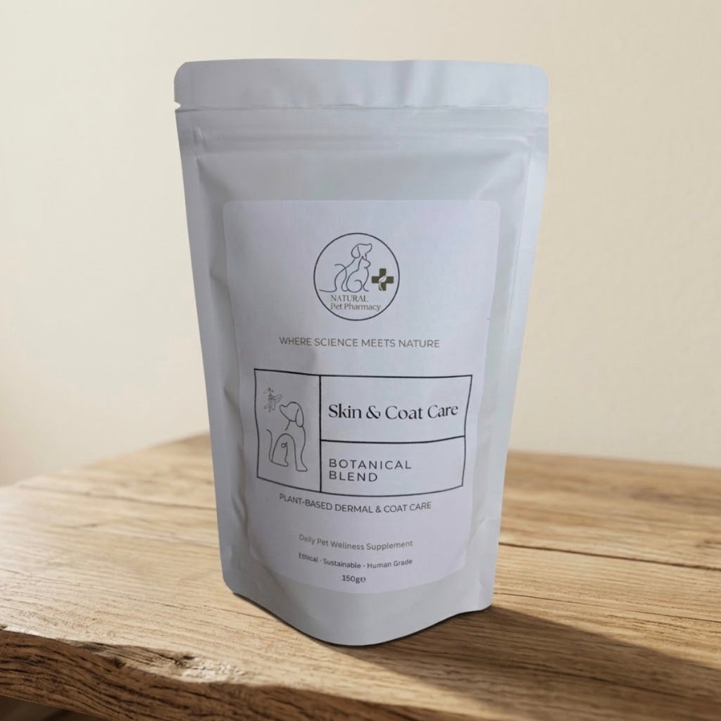 A white stand-up pouch of 'Natural Remedies' Skin & Coat Care Botanical Blend pet supplement, displayed on a wooden surface against a neutral beige background.